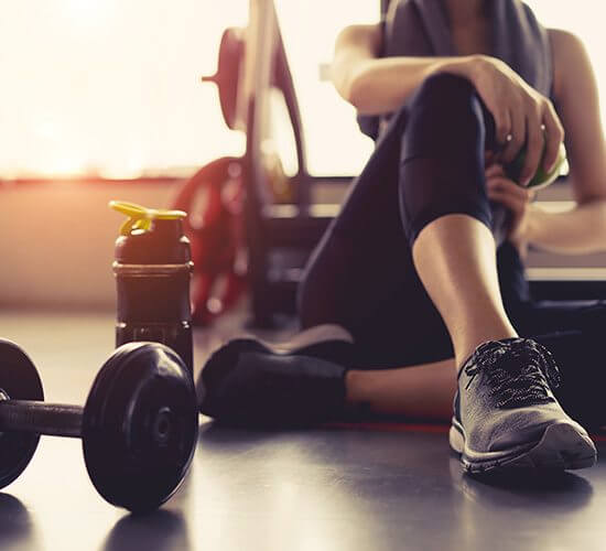 private fitness instructor is sitting on the floor after workout